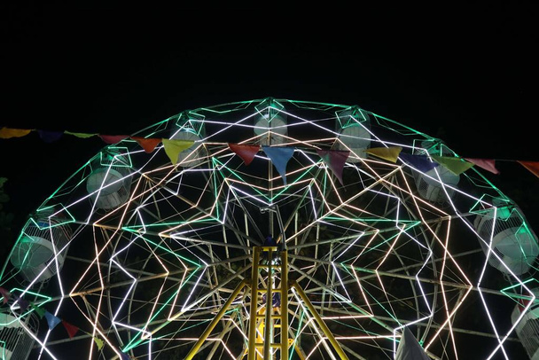 Ferris wheel at night festival in slow motion photo. High Roller - Photo, Image