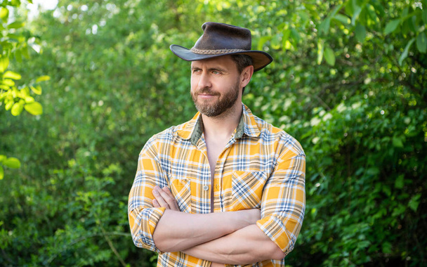 west man in cowboy hat. west cowboy in checkered shirt. western cowboy wearing west hat. - Foto, Imagem