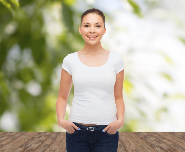 smiling young woman in blank white t-shirt - 写真・画像