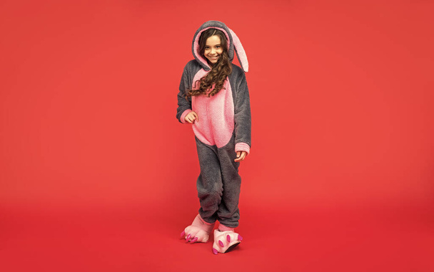 sweet dreams. comfortable pajama or home bathrobe. teen girl feeling relaxed. childhood happiness. good morning. kid wear soft night suit. full length. happy child in cozy sleepwear has curly hair. - Foto, Imagen