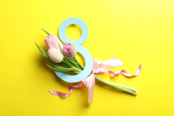 8 March card design with tulips on yellow background, flat lay. International Women's Day - Foto, Imagem