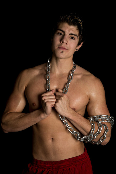 man no shirt black background chain on arm and neck look - Photo, image