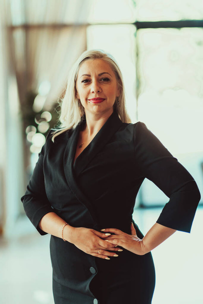 Portrait of a senior businesswoman in a modern corporation. Selective focus. High quality photo - Фото, изображение