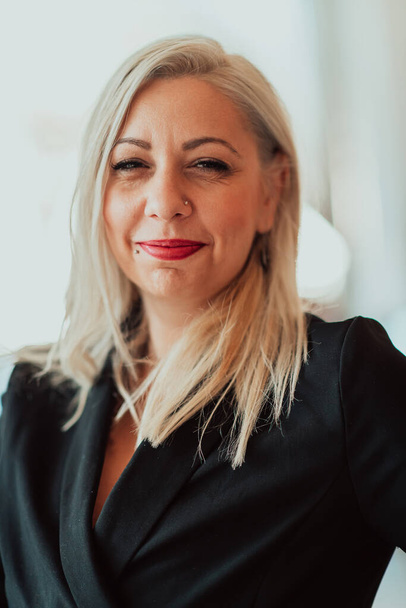 Portrait of a senior businesswoman in a modern corporation. Selective focus. High quality photo - Valokuva, kuva