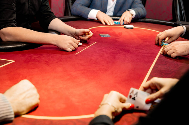 side view of men and women playing poker in a casino - Valokuva, kuva