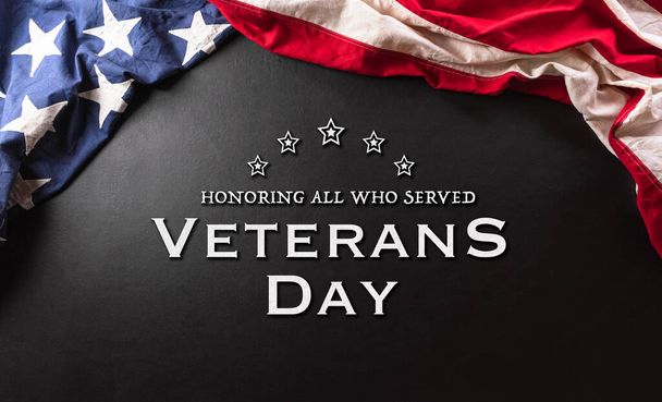 Happy Veterans day concept made from American flag and the text on dark wooden background. - Fotoğraf, Görsel
