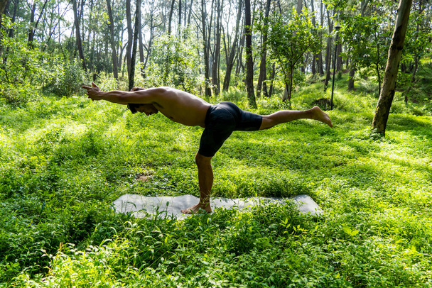 mexican man doing yoga and stretching in the forest, mexico, guadalajara - Photo, Image