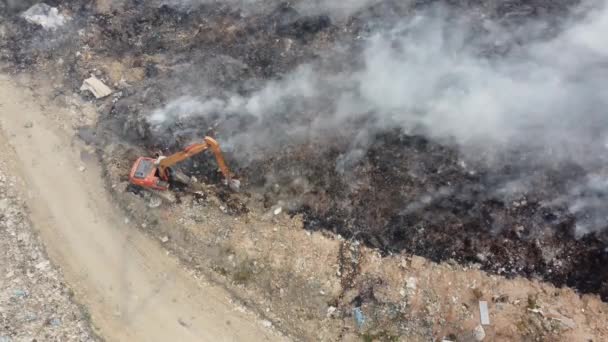 Aerial top down view excavator dig to avoid spread of fire - Materiaali, video