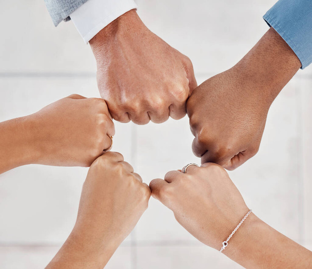 Hands of business people in circle for support in meeting, trust in team success and community in collaboration in working office. Business people, employees and workers in agreement with fist bump. - Foto, Imagem