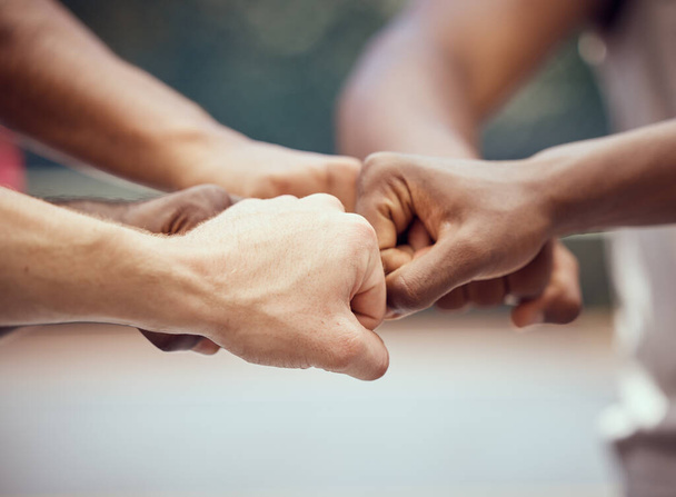 Hands, teamwork and motivation with a team of people joining their fists in a huddle or circle in collaboration. Goal, target and success with a group of friends with a vision together as a community. - Photo, image