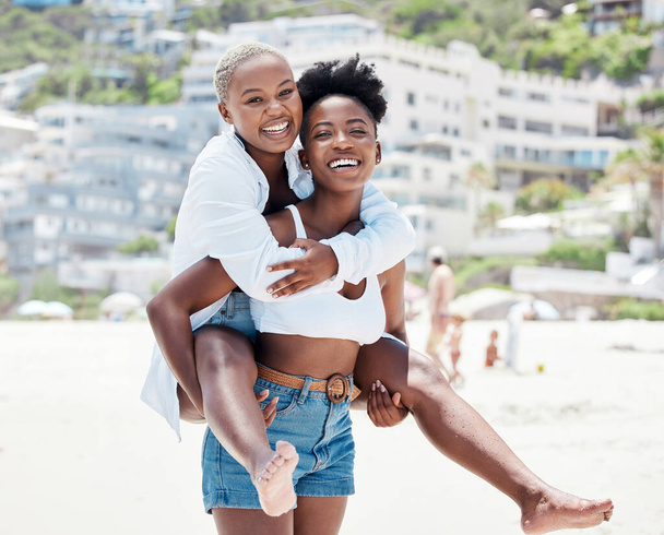 Gay, lesbian and beach with a woman lgbt couple bonding together outside during summer. Romance, dating and love with a female and her girlfriend on holiday, vacation or honeymoon by the coast. - Photo, Image