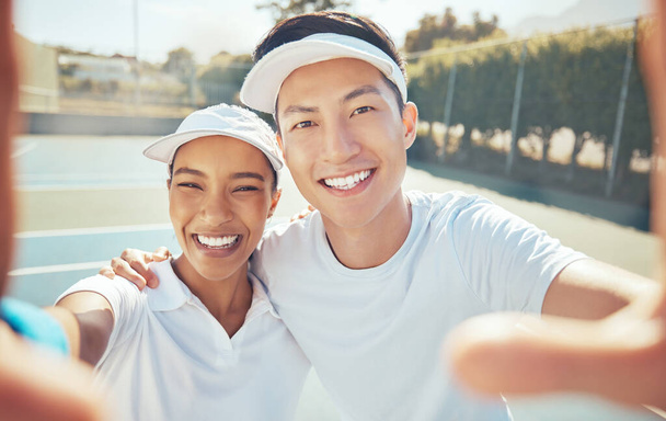 Selfie, tennis and court sports with people taking happy, smile and fun photograph for social media. Portrait of asian man, coach and winner woman after success training, workout and fitness exercise. - Fotografie, Obrázek