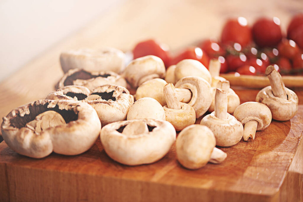 The makings of a mushroomy meal. mushrooms on a kitchen tabletop - Valokuva, kuva
