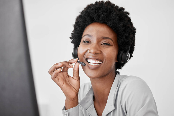 Customer support, call center and telemarketing with a woman consultant using a headset for communication in her office. Sales, crm and contact us with a female consulting on call for help and advice. - Photo, Image