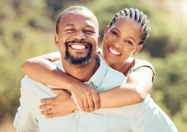 Face portrait of African couple in nature, hug on love date in park in summer and smile for care in garden in spring. Happy and relax man and woman in sun on walk in green countryside holiday. - Photo, image