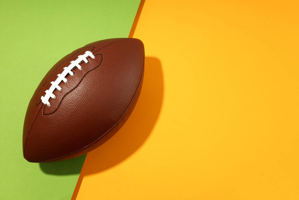 American football ball on two tone background - Photo, image