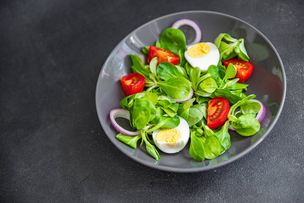 green salad egg, vegetable  tomato, onion, leaves lettuce mix fresh healthy meal food snack on the table copy space food background  - Photo, Image