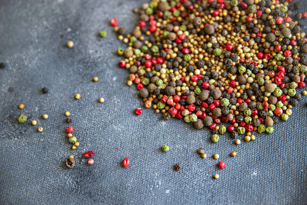 pepper peppercorn 5 spices red, black, green and white pepper, coriander food spice on the table copy space food background  - Photo, image