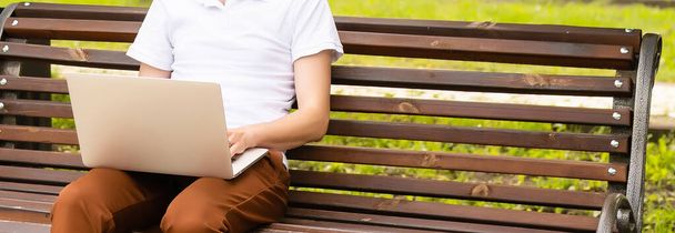 outdoor business, man with laptop in the park. - Photo, Image