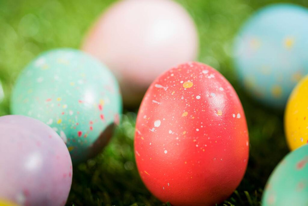 Various colorful Easters eggs on field - Photo, image