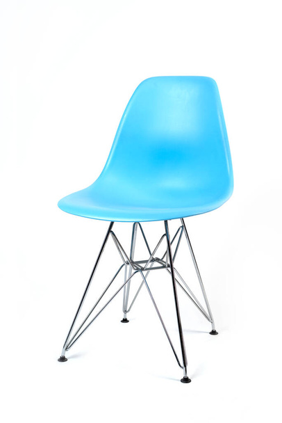 Blue color chair, modern designer. Chair isolated on white background. Kitchen or home furniture with iron legs. - Фото, зображення
