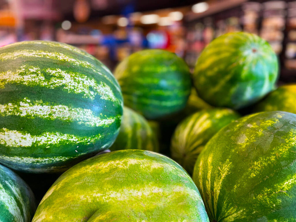 Fresh watermelons on display retail grocery store in Georgia USA - Foto, imagen