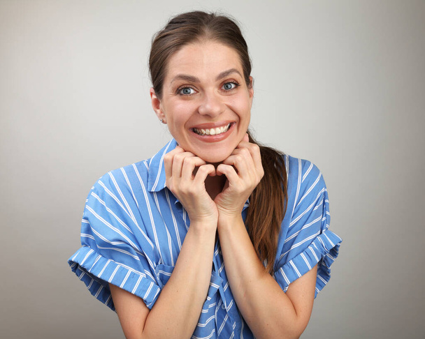 Happy emotional woman isolated portrait. Smiling girl wearing casual blue striped dress. - Zdjęcie, obraz
