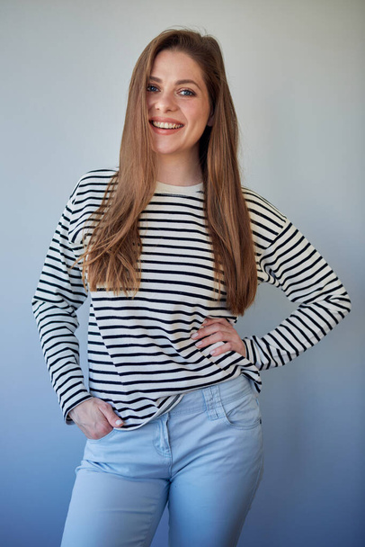 Smiling girl in striped shirt isolated portrait. - Фото, изображение