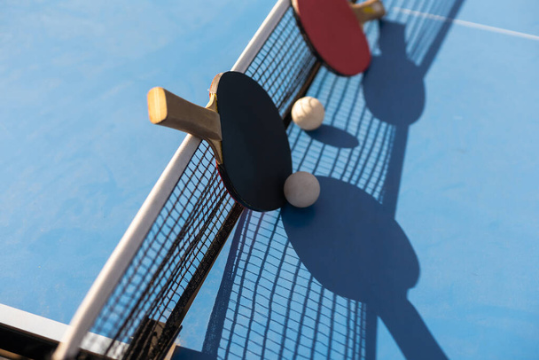 Ping pong table, rackets and balls. - Fotoğraf, Görsel