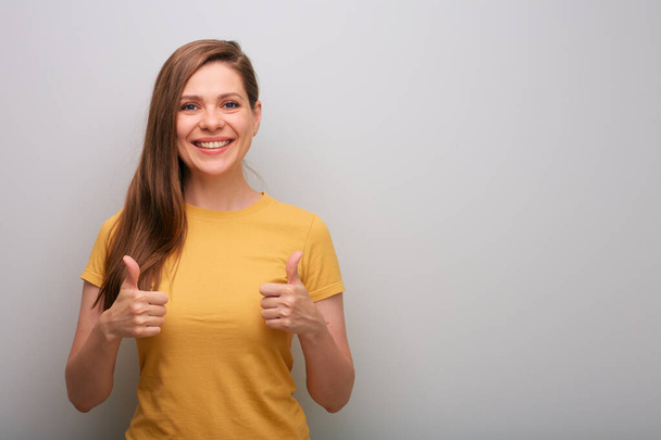 Isolated portrait happy woman with thumb up. Smiling and happy girl. - 写真・画像
