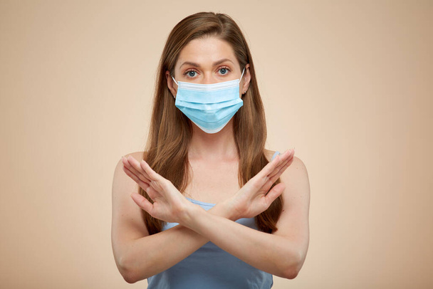 Woman with medical mask crossed arms stop gest, isolated portrait. - Foto, afbeelding