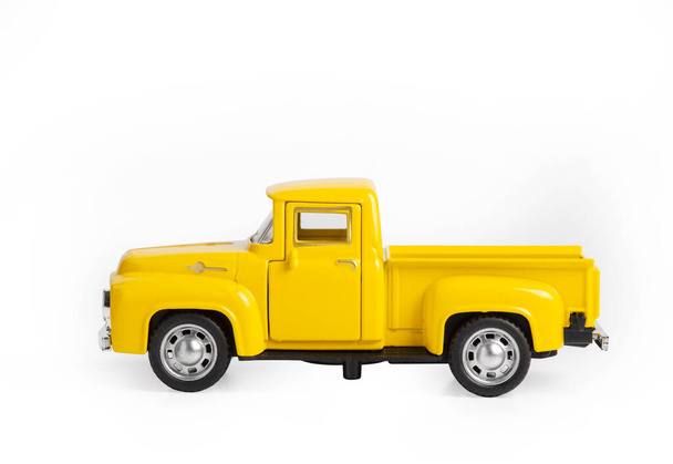 yellow toy car the truck isolated on a white background. - Photo, image
