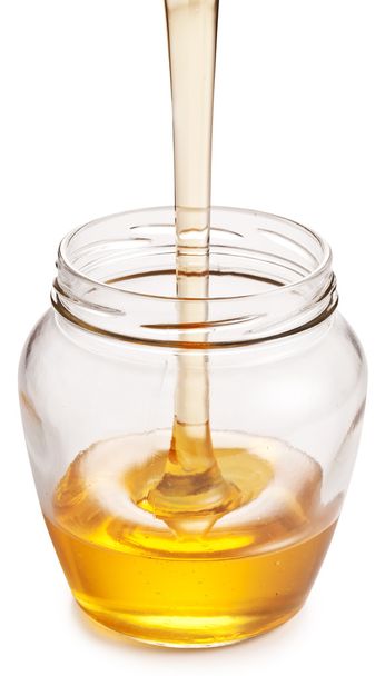 Glass can full of honey.  - Φωτογραφία, εικόνα