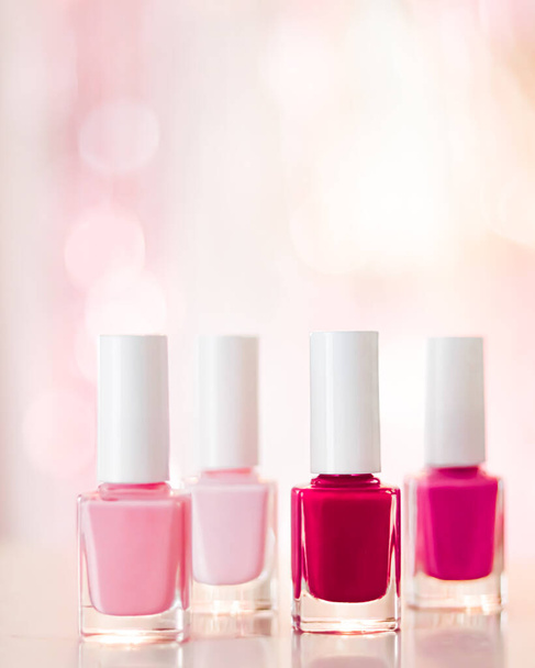 Shades of pink and red nail polish set on glamour background, nailpolish bottles for manicure and pedicure, luxury beauty cosmetics and make-up brand ad - Photo, Image