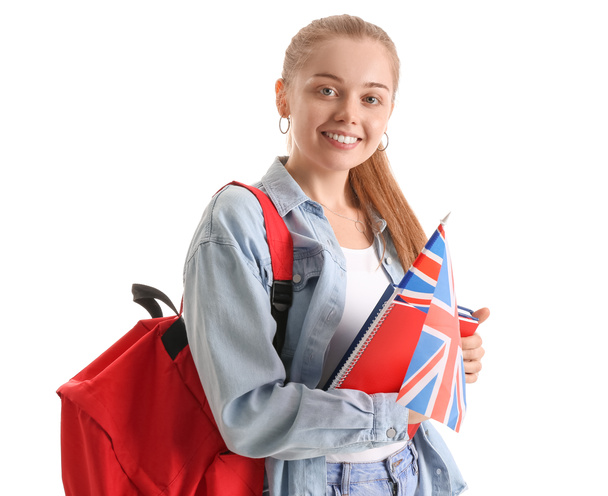 Young woman with UK flag, books and backpack on white background - Foto, imagen