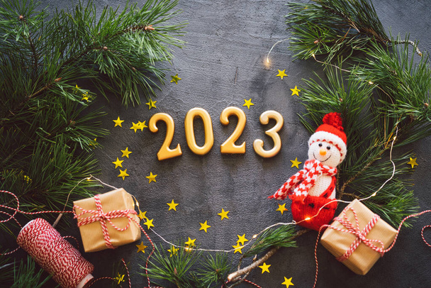 Happy New Years 2023. Christmas background with cone tree and Christmas decorations. Christmas holiday celebration. New Year concept. - Foto, afbeelding