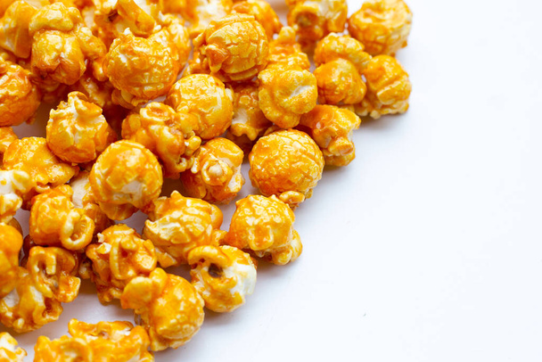 Honey caramel popcorn on white background. - Foto, immagini