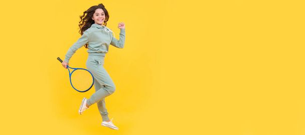 happy energetic kid jump in sportswear with squash racquet running to success, stamina. Horizontal poster of isolated child face, banner header, copy space - Фото, изображение