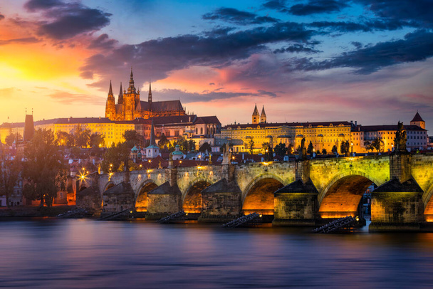Charles Bridge sunset view of the Old Town pier architecture, Charles Bridge over Vltava river in Prague, Czechia. Old Town of Prague with Charles Bridge and Castle in the background, Czech Republic. - Photo, Image