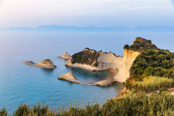 Beautiful view of Cape Drastis in the island of Corfu in Greece. Cape Drastis, the impressive formations of the ground, rocks and the blue waters panorama, Cape Drastis, Corfu, Greece, Ionian Islands. - Photo, image