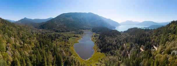Aerial View of Green Canadian Nature Landscape. Lake around Mountains. Sunny Summer Day. Near Harrison Hot Springs, British Columbia, Canada. Panorama Background - Fotó, kép