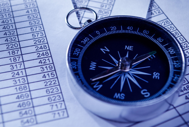 Compass Instrument on Top of Paper Reports - 写真・画像