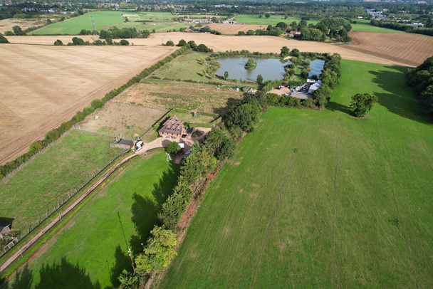 High angle footage and aerial view of harvesting crops at farm view on a sunny day at London Near to St Albans England. - Valokuva, kuva