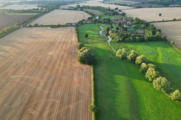 High angle footage and aerial view of harvesting crops at farm view on a sunny day at London Near to St Albans England. - 写真・画像