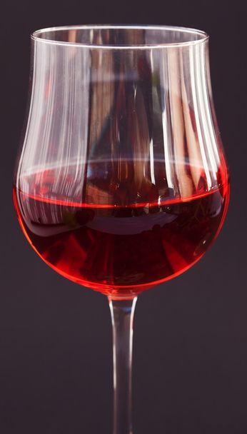 Glass of wine on a black background - Photo, image