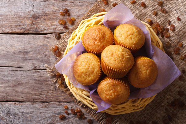 Orange muffins in a basket top view horizontal - Photo, Image