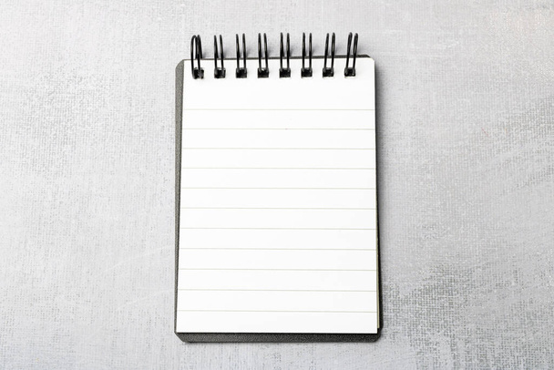 Notepad on a gray background. - Photo, image