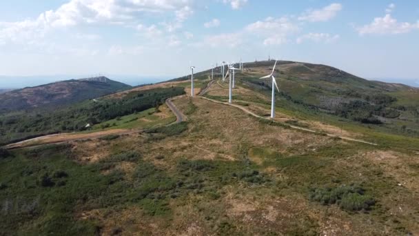 eolic generators spining with the wind in the mountains on a sunny day. High quality 4k footage - Πλάνα, βίντεο