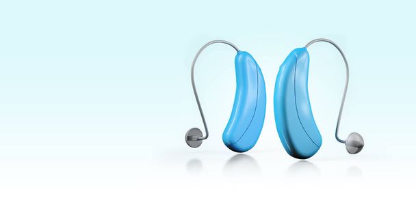 Hearing aids for the deaf blue color with copy space - Fotoğraf, Görsel