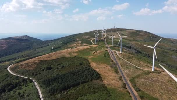 eolic generators spining with the wind in the mountains on a sunny day. High quality 4k footage - Felvétel, videó